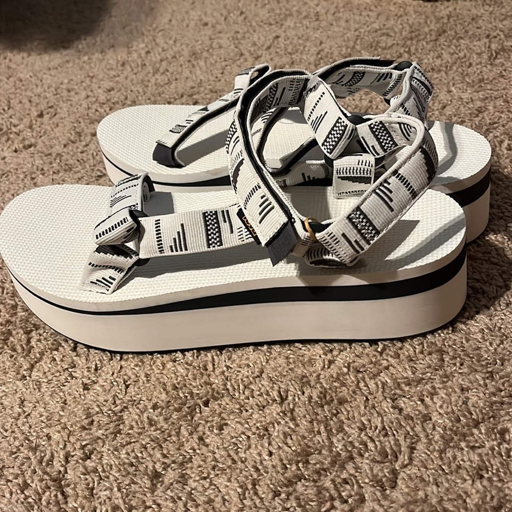 Brand new platform tevas. White with grey patterned straps.